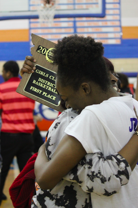 Jones and her mother embrace after the Lady Greyhounds district championship win.