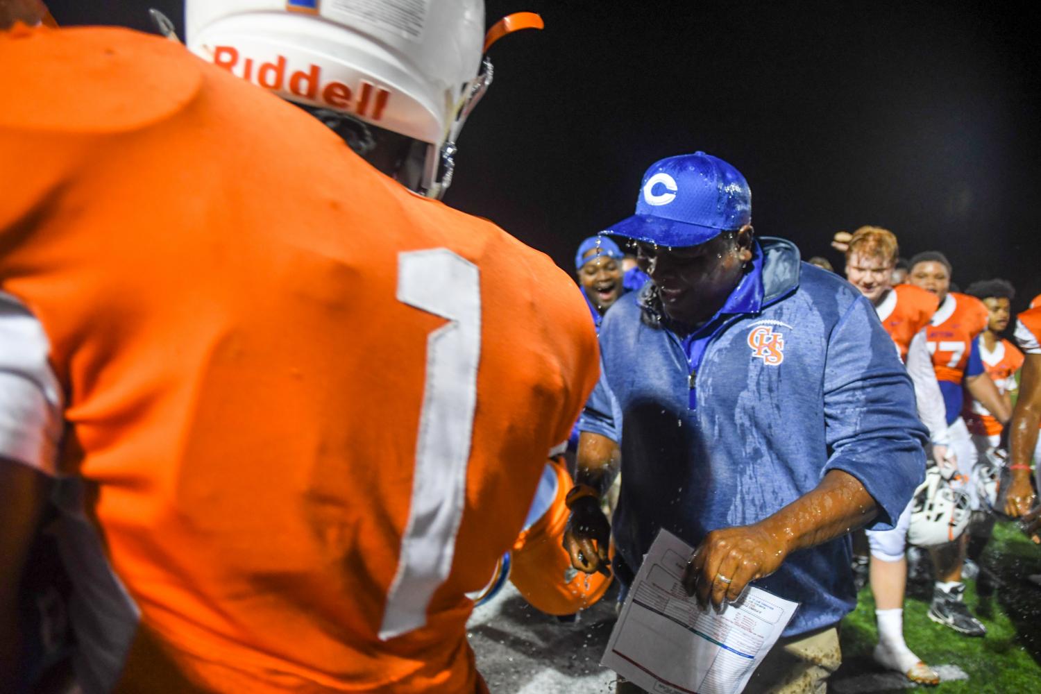 Water is dumped on head coach Linwood Barnes.  Photo by Michael Melinger.