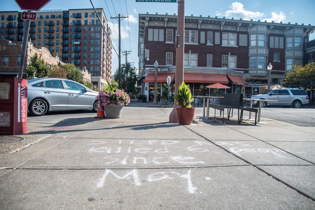 Chalk written message saying STL PD has killed 6 people since May on a sidewalk in the Central West End.