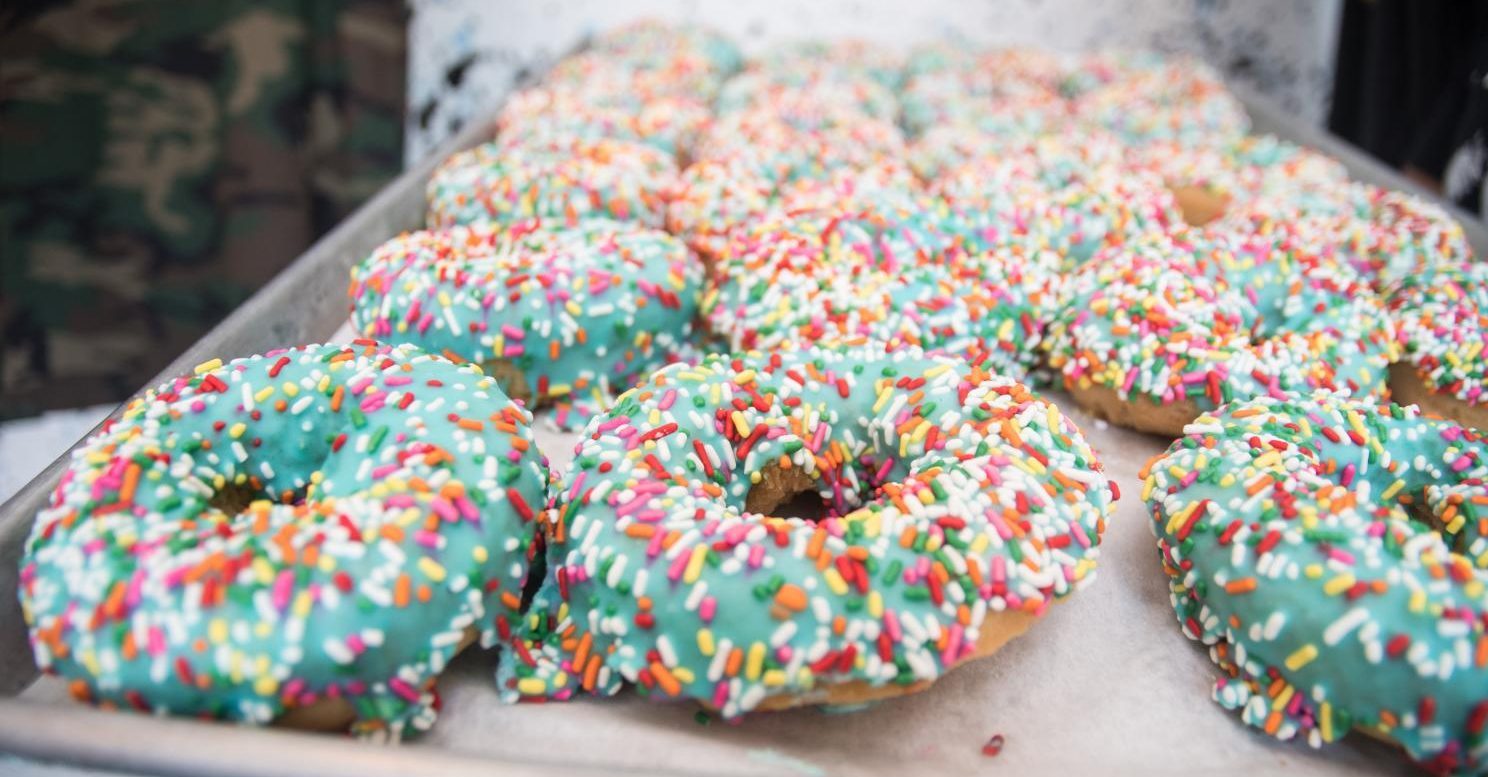 Trays of iced donuts at Strange Donuts