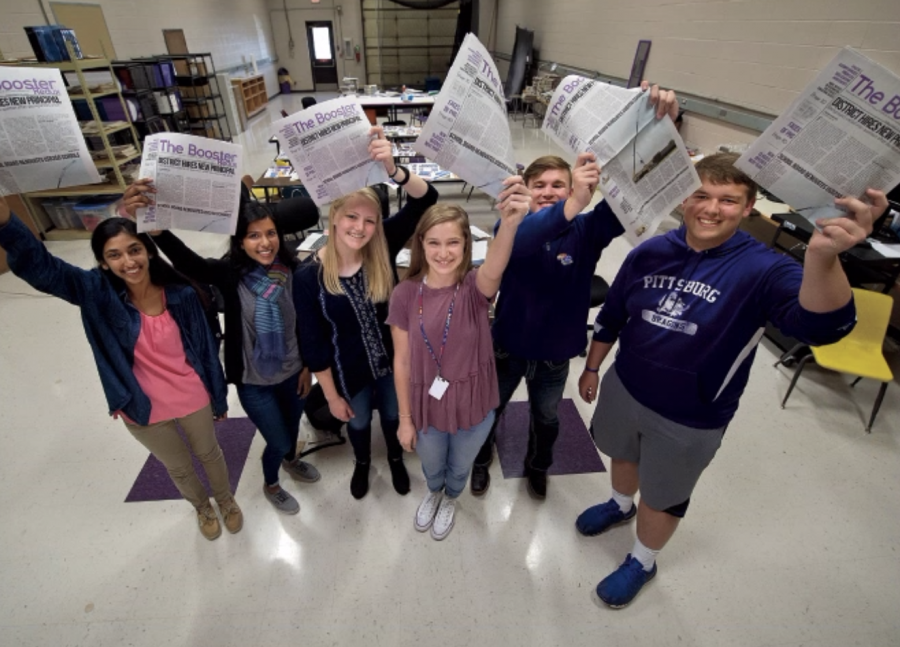 Pittsburg (Kan.) High School student journalists Trina Paul, from left, Gina Mathew, Kali Poenitske, Maddie Baden, Patrick Sullivan and Connor Balthazor hold up copies of The Booster Redux on Wednesday, April 5, 2017, containing their article that led to the resignation of the school’s newly hired principal. (Keith Myers/Kansas City Star/TNS)
