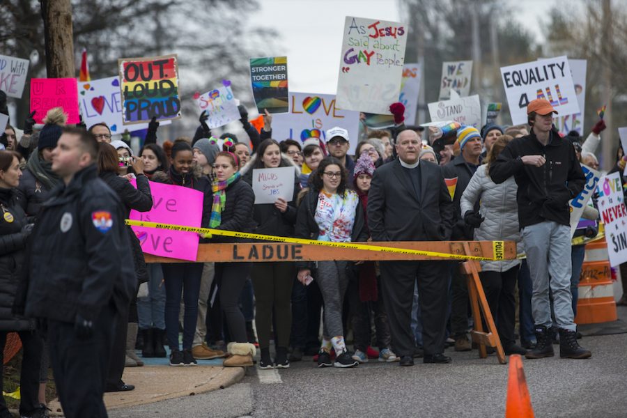 John Burroughs students and members of the community rally in defense for star football player, Jake Bain, who recently came out as gay. The students and members of the community protest on Clayton Road against Westboro Baptist Church.