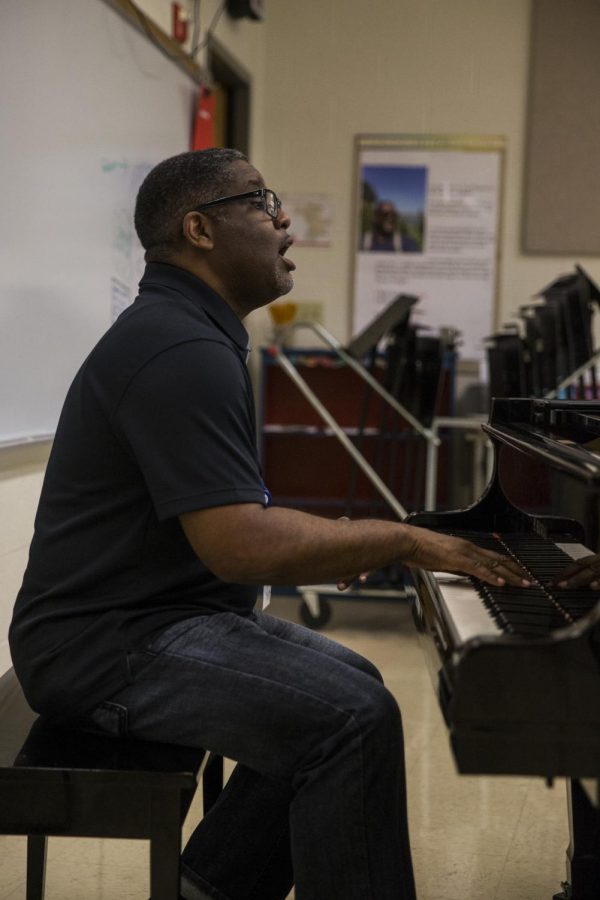 Mr. Brown, the new part-time teacher at Clayton, teaches his show choir music and accompanies them on the piano. 