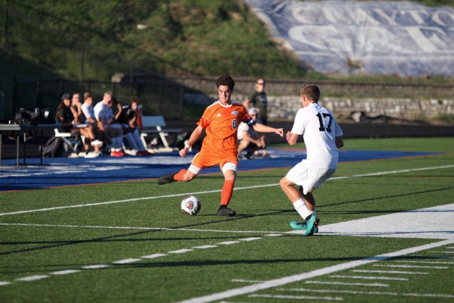 Dulle (8) moves to kick the ball past an opponent from Pattonville during their game on Sep. 12. The hounds defeated Pattonville and won the game 6-1.