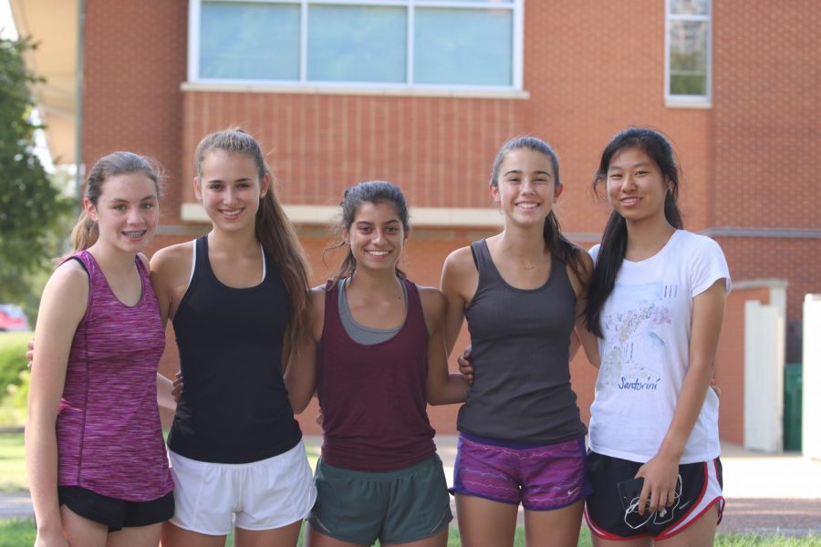 (From left to right) Sophomore Ruthie Pierson, juniors Ruby Gallegos and Sammy Williams and freshmen Camilla Meyers and Carol Zhang at cross country practice.