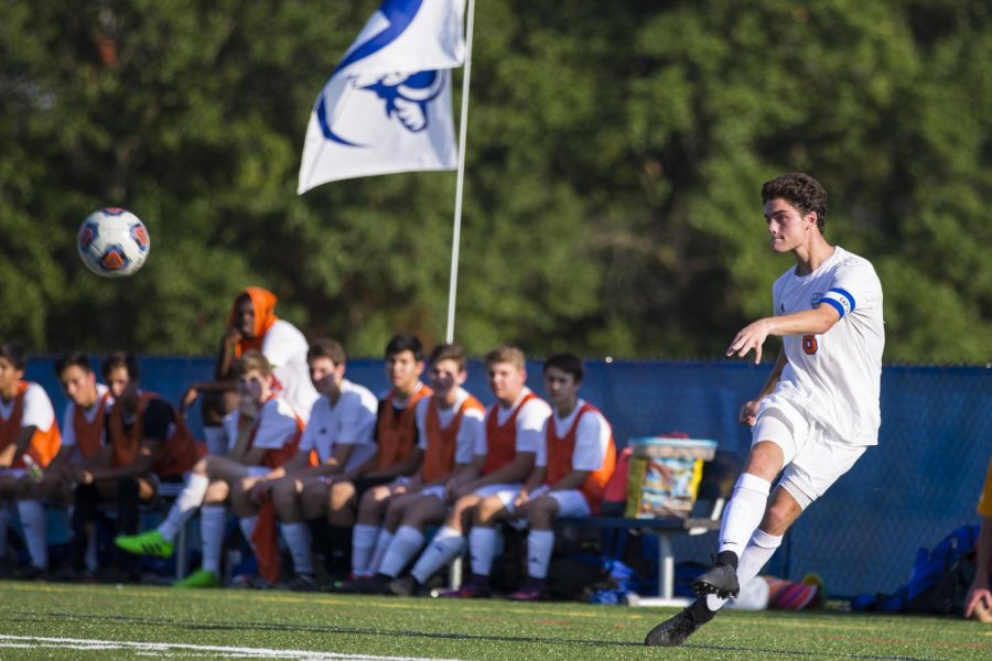 Senior James Dulle, who scored both goals for Clayton, passes the ball to a teammate.