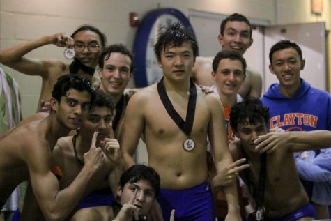 The boys varsity swim team poses after their first place finish at the conference meet on Wed, Oct. 24. Many swimmers will move on to the State Championship based on their performance on Wednesday or their earlier qualifications.