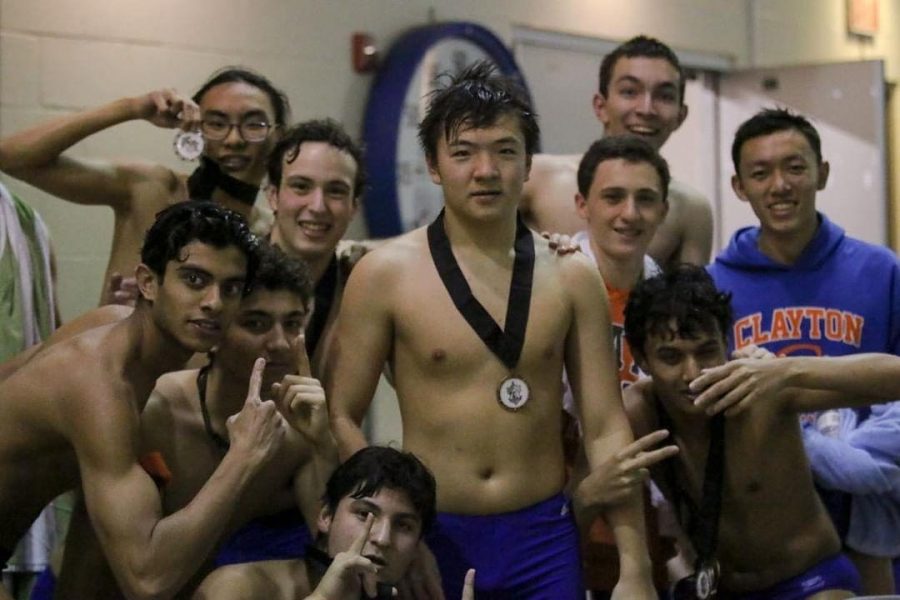 The boys' varsity swim team poses after their first place finish at the conference meet on Wed, Oct. 24. Many swimmers will move on to the State Championship based on their performance on Wednesday or their earlier qualifications.