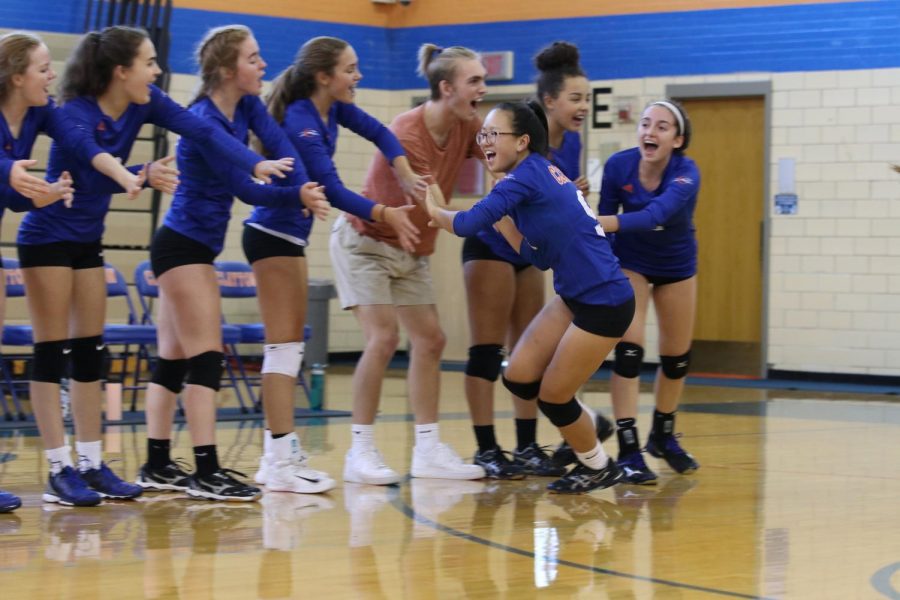 The girls varsity volleyball team hypes themselves up just before a game. The inclusive policy of volleyball and other Clayton sports has come into question recently as the athletic participation policy changed.