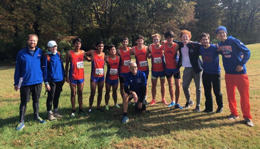 The boys' varsity cross country team poses just a few minutes after all completing the District 5k race in personal record times. Shortly after, the hounds were awarded first place in the district and advanced to the State Championship.
