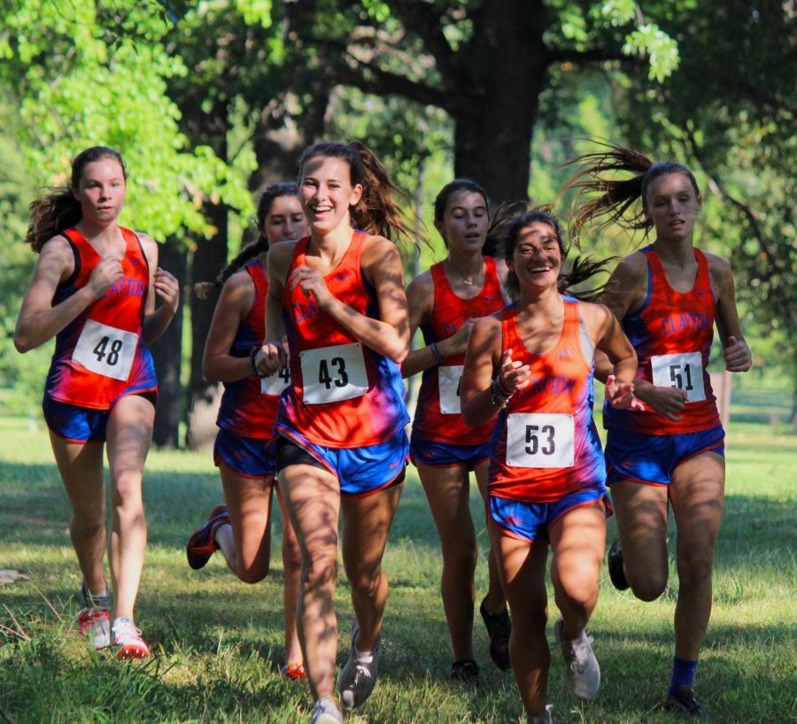 The girls varsity cross country team runs together during the Affton Invitational. One of the most inclusive sports, cross country allows full playing time for anyone interested.
From left to right: sophmore Ruthie Pierson, freshman Paige Rawitscher, junior Ruby Gallegos, freshman Camilla Meyers, juniors Sammy Williams and Mira Upshaw.