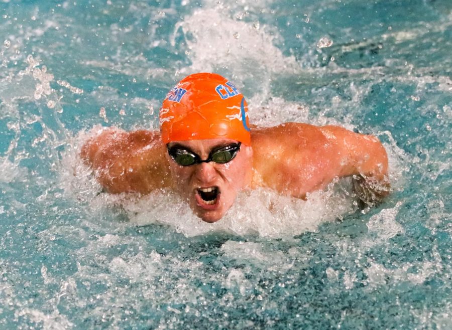 A swimmer from the boys' varsity swim team competes during their senior night match against Burroughs. The hounds won the meet.