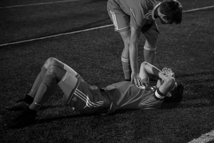 Clayton Greyhounds midfielder James Dulle (8) is comforted by a teammate after the Greyhounds 2-1 loss during the district championship match of the Class 3 District 5 MSHSAA tournament against the Ladue Rams on October 31, 2018 at Centene Stadium in St. Louis, MO.