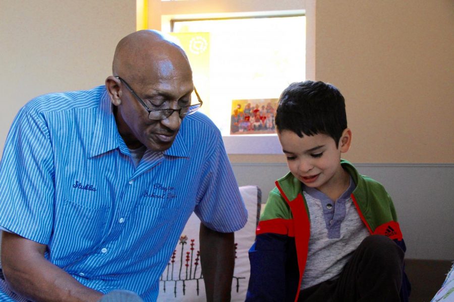 Mr. Thurmon reads a story with Family Center student, Paul Castellano. 