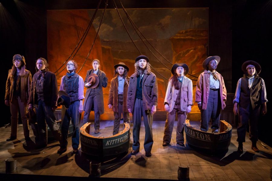 The cast of the CHS fall play, Men on Boats, stands together on stage during the performance.