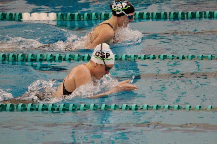 Mottl competes in a breaststroke event during a swim meet.