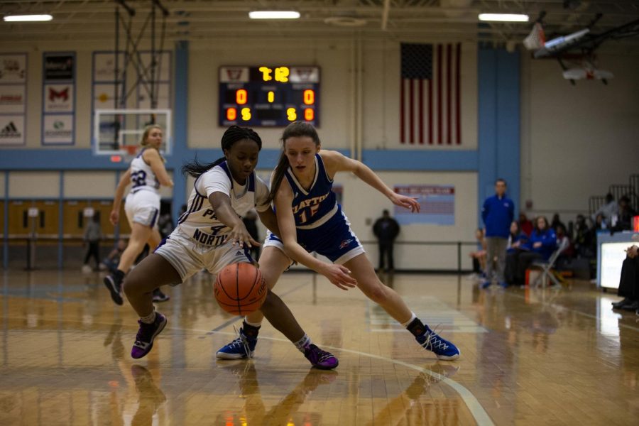 Parkway North Sophomore Aliyah Williams (4) attempts to steal the ball from Junior Mira Upshaw (15) during Round One of the MSHSAA tournament against Parkway North at Parkway West on March 5, 2019.