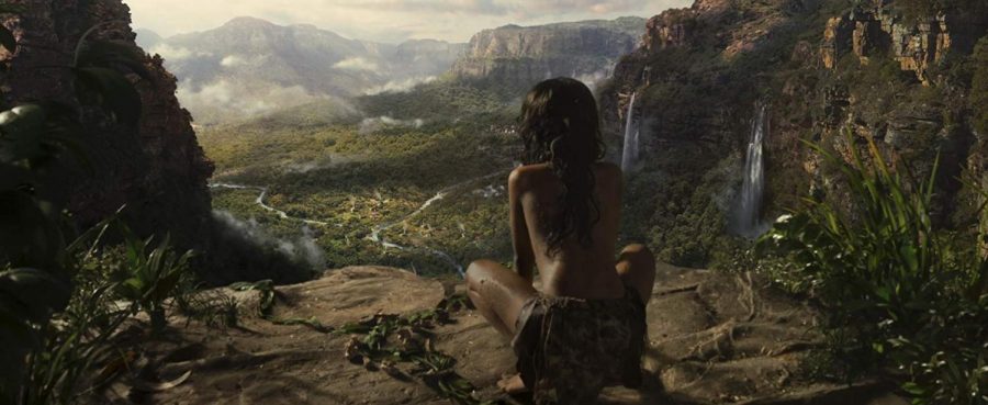 Rohan Chand stands atop a cliff in Mowgli: Legend of the Jungle (2018).