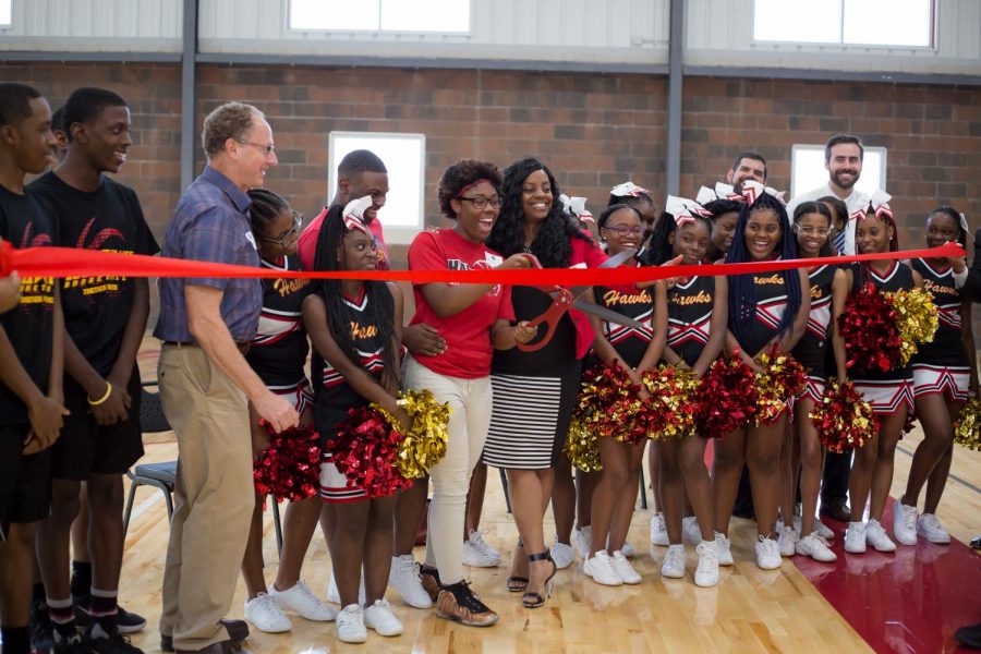 LFLA founder Marshall Cohen (third from left) and students at the ribbon cutting ceremony for the school's new gym.