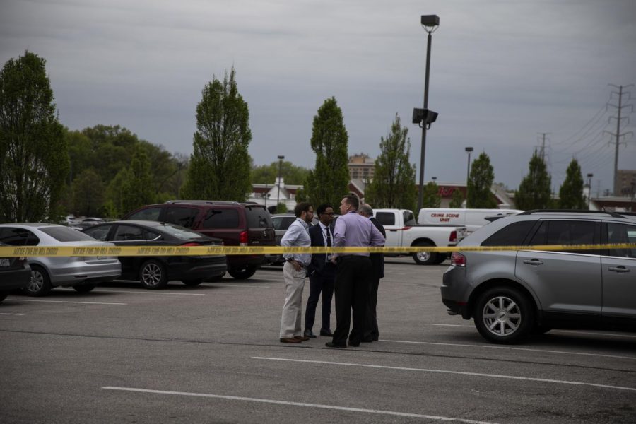 Wesley Bell, St. Louis County Prosecutor, is seen standing with several officers.