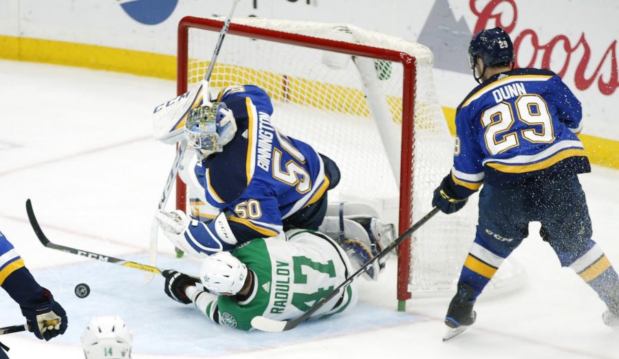 The St. Louis Blues' Jordan Binnington (50) saves the puck in Game 7 of the Western Conference semifinals at the Enterprise Center in St. Louis on Tuesday, May 7, 2019. The Blues beat the San Jose Sharks in the Western Conference Finals on Tuesday, May 21, 2019, advancing to the Stanley Cup Finals. 