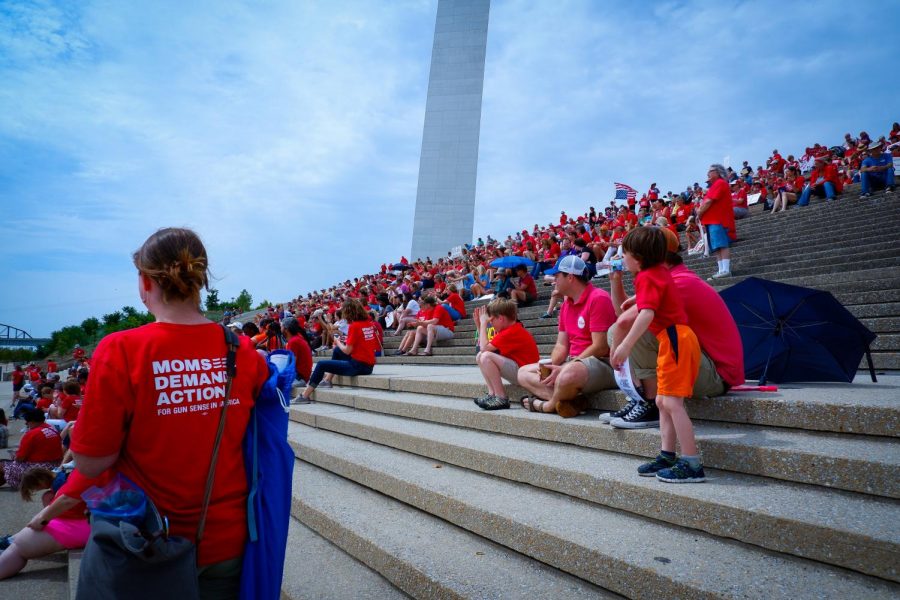 Protestors gather on the steps of the Gateway Arch to listen to a speech this Saturday.