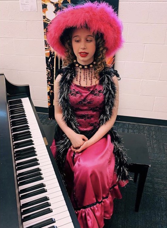 Holly Connor prepares for a performance backstage at Wydown's 2019 Spring Musical, Newsies. 