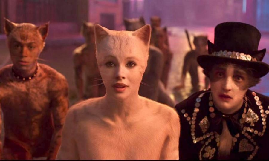 Francesca Hayward (center) and Laurie Davidson (right) play Victoria and Mr. Mistoffelees, respectively, in the 2019 adaptation of "Cats."