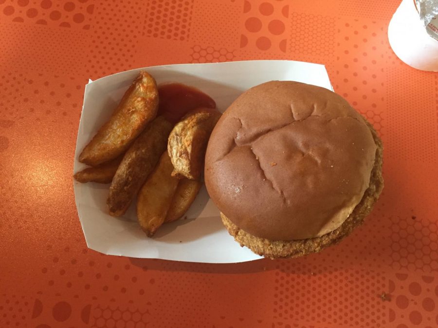 Picture of a hamburger and potato wedges, found in the CHS Cafeteria.