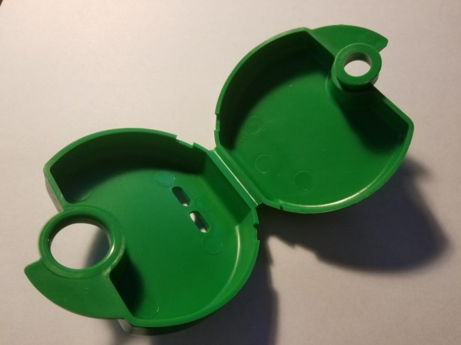 A case for a plastic retainer. The retainers are worn to prevent tooth movement after the end of orthodontic treatment. 