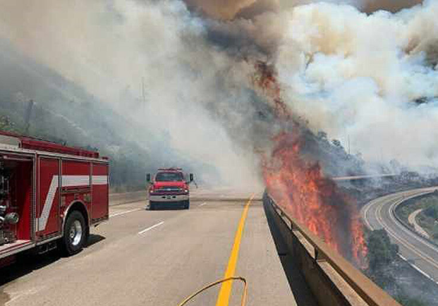 A portion of one of the wildfires was burning in the median between Interstate 70 in both directions.