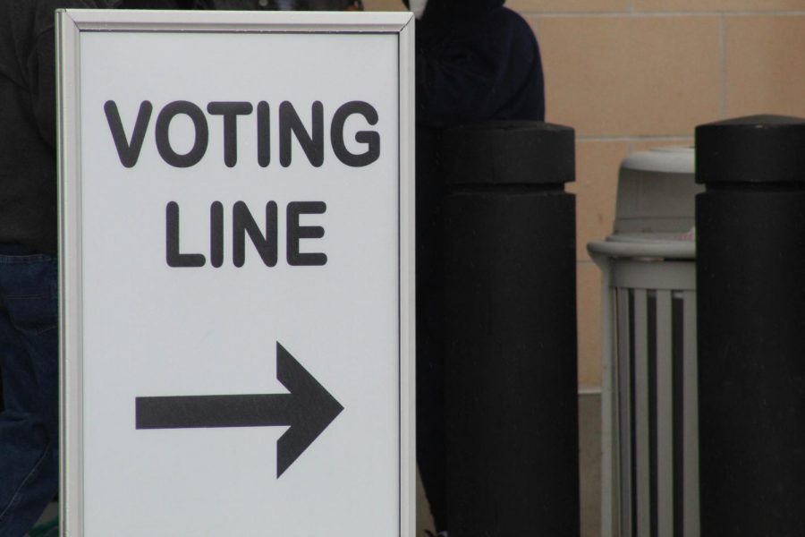 A voting line sign. Voting has been restricted to those over 18.