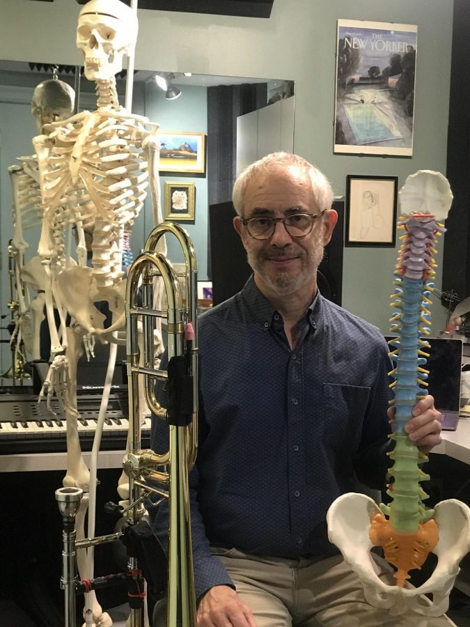 SLSO principal trombonist Timothy Myers in his studio. Over the summer, Myers became a Licensed Body Mapping Educator.