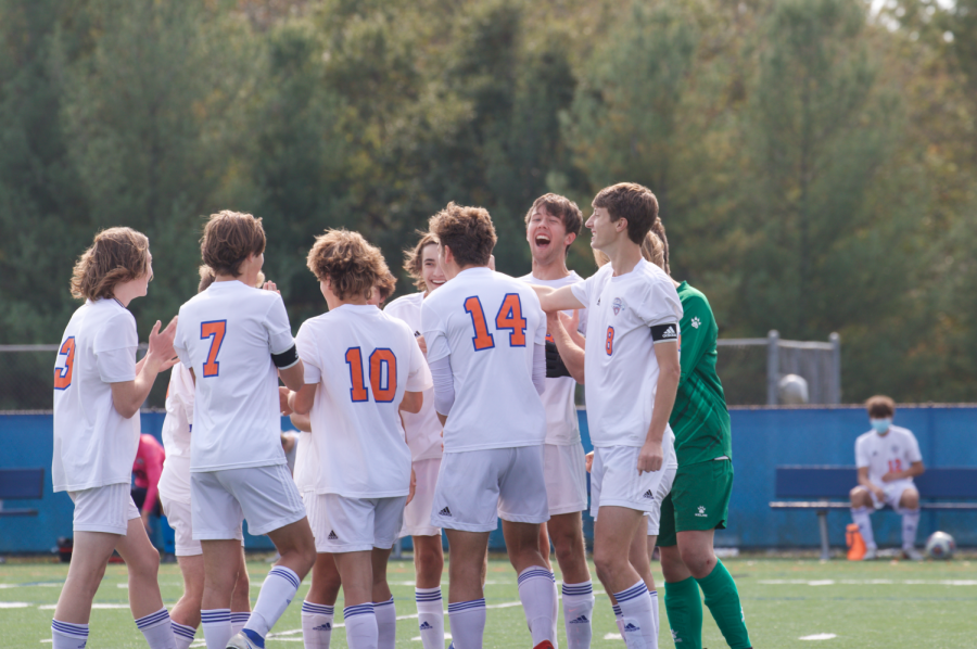Members of the CHS boys' soccer team huddle before playing Ladue on October 17 