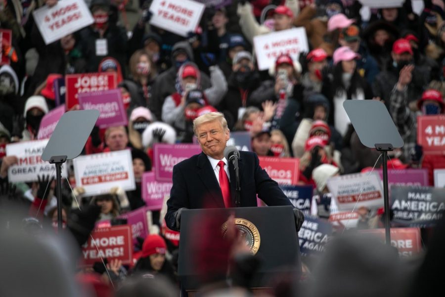 U.S. President Donald Trump smiles while disparaging Democratic presidential nominee Joe Biden at a campaign rally at Oakland County International Airport on October 30, 2020 in Waterford, Michigan. With less than a week until Election Day, Trump and his opponent Joe Biden are campaigning across the country. 
