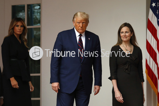 President Donald Trump with first lady Melania Trump, left, arrive to introduce Judge Amy Coney Barrett, right, as his Supreme Court Associate Justice nominee in the Rose Garden of the White House in Washington, D.C., on Saturday, Sept. 26, 2020