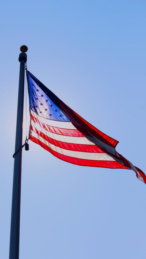 An American flag waves outside of Clayton High School. The Centene Centennial Plaza, which houses this flag, has often served as the site of school protests and walkouts.