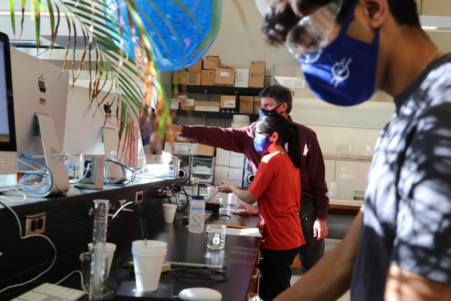 Chemistry teacher Nathan Peck instructs students on a lab experiment in the CHS science wing.  Many students havent been doing as many hands-on experiments because of the pandemic.