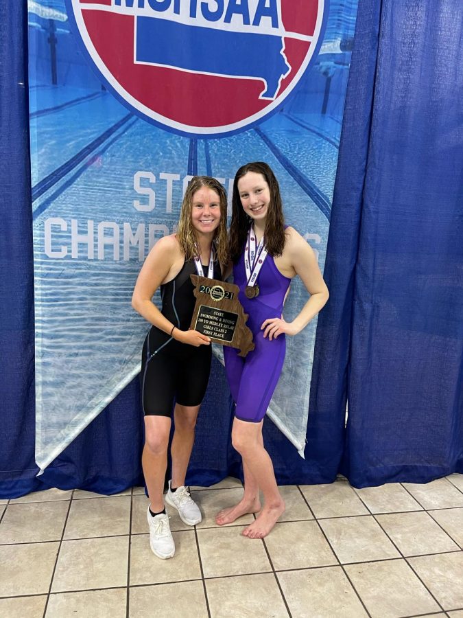 Senior Sophie Thompson and Freshman Anna Stouffer celebrate at the MSHSAA Girls Swim and Dive State Championships. The team was able to compete safely due to a host of Covid safety measures. 
