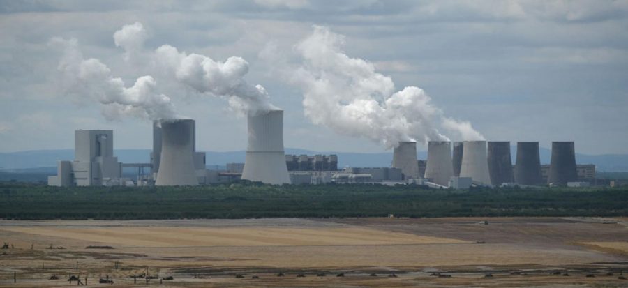 Steam rises from cooling towers of the Boxberg coal-fired power plant next to reconstituted land of the plants adjacent open-pit lignite coal mine on July 9, 2019 near Weisswasser, Germany. Legislation to phase the country off coal passed both houses of parliament Friday, July 3, 2020.