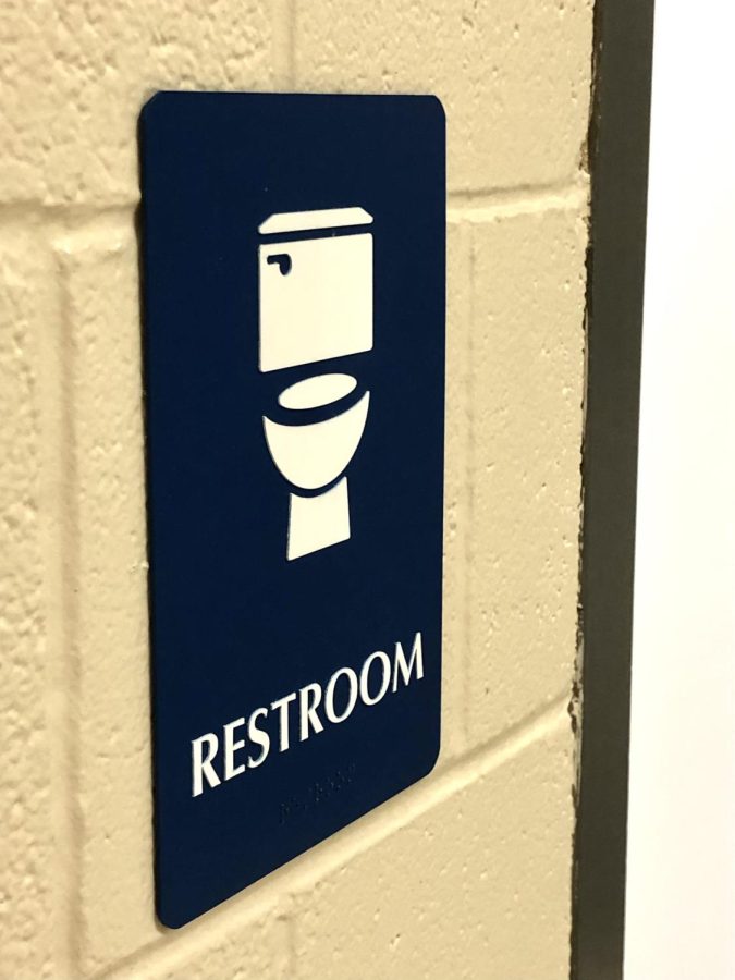 New signs are mounted to display the opening of gender neutral bathrooms.