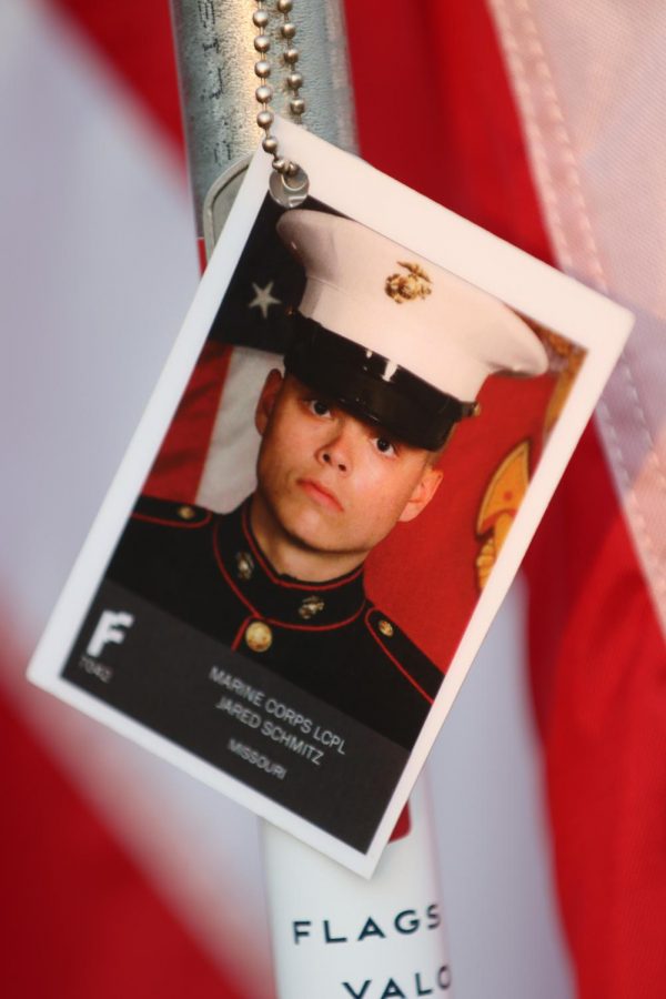 Jared Schmitzs photo on his honorary flag at Art Hill in Forest Park