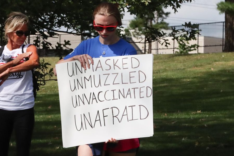 Many attendees carried signs proclaiming their resistance to vaccination against COVID-19.