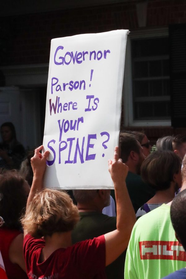 The premise of the rally was to urge Missouri Governor Mike Parson into calling a special session of the state legislature, in an attempt to stand up to an OSHA regulation, announced by President Joe Biden on September 9, that would require vaccination or weekly testing for staff of businesses with over a hundred employees.