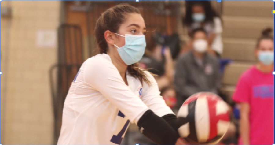 Sarah bumps the ball to a teammate during a home game.