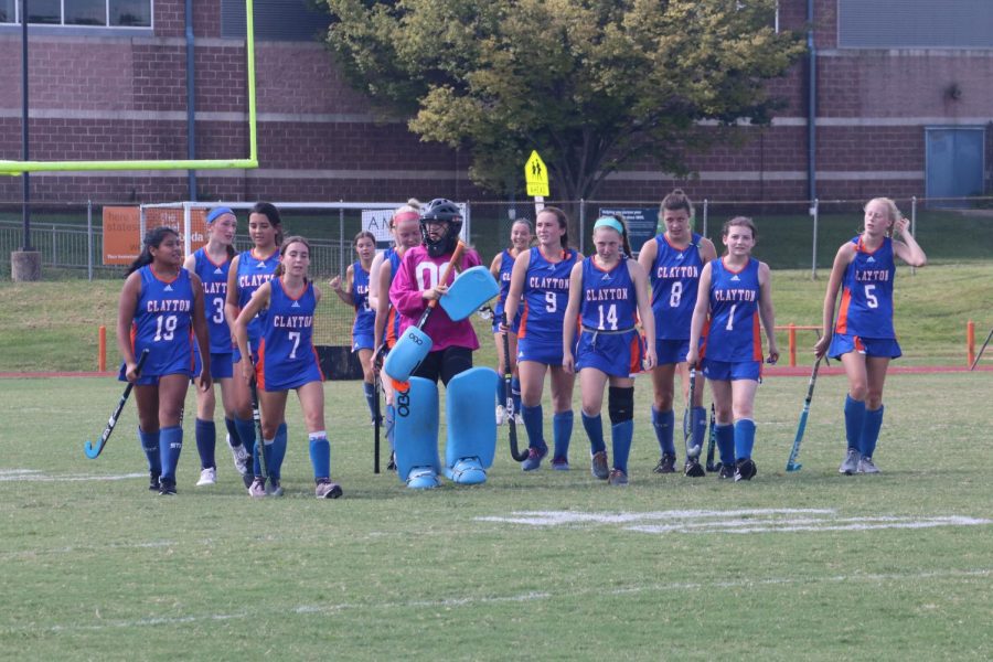 Hannah Teagan, goalie, leads the varsity field hockey team across the field during a game. 