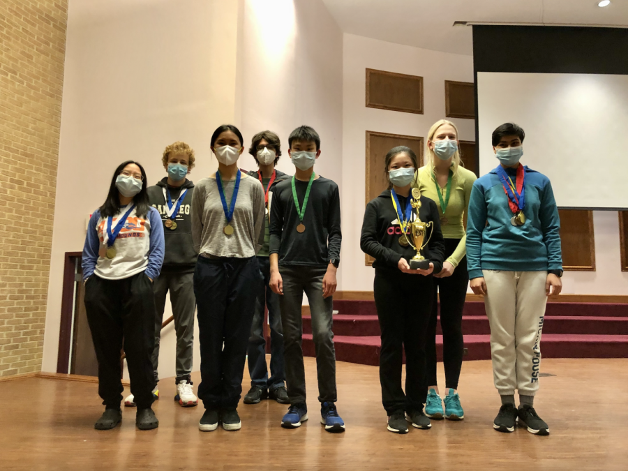 The CHS Science Olympiad team standing with their trophy. 