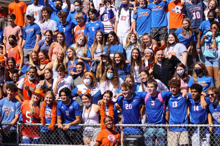 Clayton students cheer on the football team during the homecoming game. 