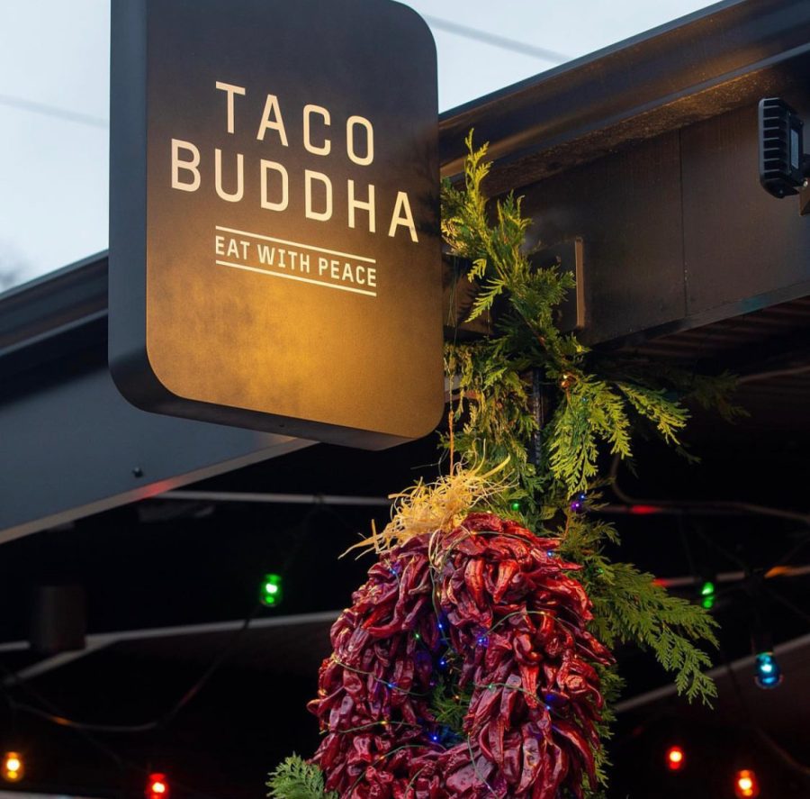 Sign hanging out front of Taco Buddha in University City. 