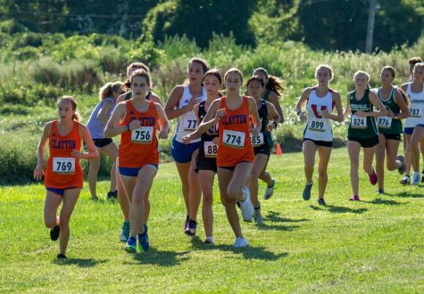 Sophia Pelligreen, Isabel Erdmann, and Lauren Van Rhein leading the Greyhounds to a team win at the Ladue Invitational in September.